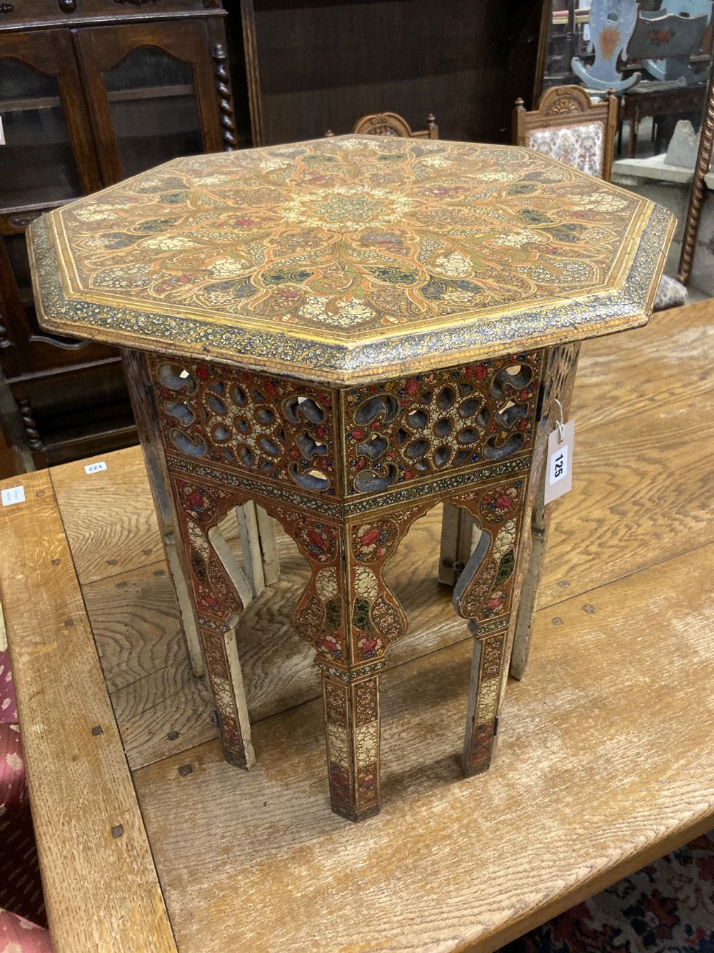 An Indian octagonal painted occasional table, width 50cm height 54cm